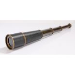 Early 20th Century three draw telescope, with a black leather grip, 18cm long when closed