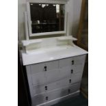 White painted pine dressing table, with bevelled plate above two short and three long drawers