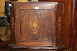 Victorian mahogany corner cabinet with marquetry inlay, the paneled door opening to reveal a