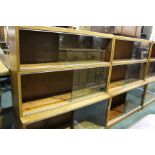 Pair of 20th Century Globe Wernicke style mahogany bookcases, the three-tier sections with glass