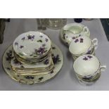 Hammersley & Co porcelain tea service, with place settings for six, decorated with purple flowers (