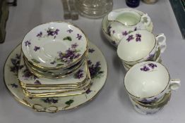 Hammersley & Co porcelain tea service, with place settings for six, decorated with purple flowers (