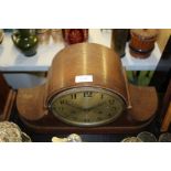 Edwardian oak mantle clock, the swept case with beaded frieze, the silvered dial with Arabic