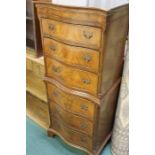 20th Century mahogany veneered chest of six drawers, the serpentine front raised on bracket feet,