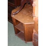 20th Century oak drinks cabinet, the octagonal top raised on two doors, flanked by two open shelves,