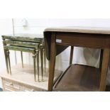 Nest of three metal tables with marble tops, together with a 20th century drinks trolley with a drop