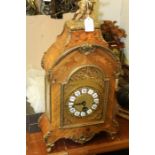 19th Century French style mantel clock, the marquetry inlaid case with brass putto pediment, the