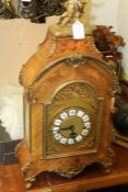 19th Century French style mantel clock, the marquetry inlaid case with brass putto pediment, the