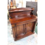 Victorian mahogany chiffonier, the point arched back with open shelf, above a cushion moulded frieze
