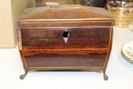 George III mahogany tea caddy, with lion mask handles, raised on claw and ball feet