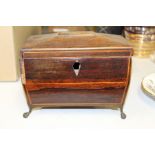 George III mahogany tea caddy, with lion mask handles, raised on claw and ball feet