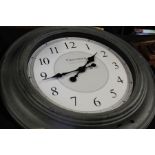 Greenwich Clock Company wall clock, the white dial with Arabic numerals, housed in a grey painted