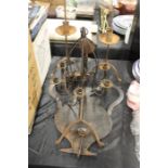 Wall mounted candle sconce with twin handled urn form silhouette back, metal six branch