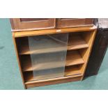 Veneered bookcase with two sliding glass doors and two adjustable shelves, 75cm wide