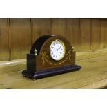 Edwardian mahogany and marquetry inlaid mantle clock, the arched case with swag and harebell