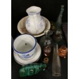 Blue Mountain style model bear, jug and non contemporary washbowl, glass decanters, ink bottles etc.