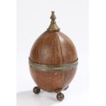 Early 20th Century coconut box, with a finial top and coconut base, 18cm high