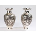 Pair of silver Iranian vases, decorated with flower scrolls and birds, three character mark to the