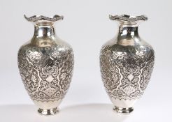 Pair of silver Iranian vases, decorated with flower scrolls and birds, three character mark to the