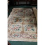 Large Chinese rug, with foliate decorations within a geometric pattern, approximately 274cm x 320cm