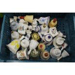 Collection of decorative porcelain bells, collection of glass milk bottles (qty)