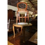 Circular glass-topped cane coffee table, with cabriole carved legs, 72cm diameter, together with