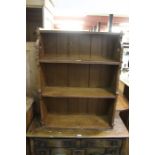 Arts and Crafts style oak open bookcase, with pierced decorations to the side, 74cm wide