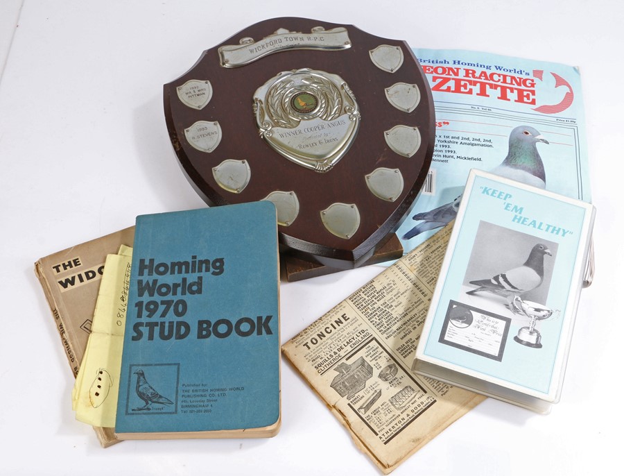 Racing pigeon related ephemera, to include trophy, stud book, VHS video etc.
