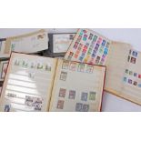 Two stamp albums containing U.K. stamps, first day covers album, Post Office stamp picture card