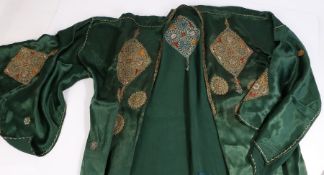 Palestinian green silk robe, with embroidered foliate and diamnond decoration