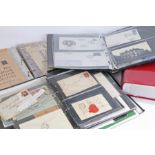 Four albums containing Royal Mail first day covers, stamp postcards etc. (4)