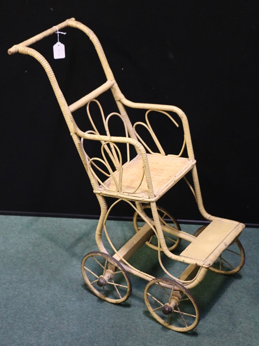 Wicker dolls pushchair with scrolled back and frame