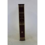 Mathematical Principals of Natural Philosophy by Sir Isaac Newton, published 1992, housed in a