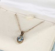 Silver necklace and pendant set with a blue stone, housed in a Kit Heath box, 3.7g