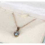 Silver necklace and pendant set with a blue stone, housed in a Kit Heath box, 3.7g