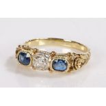 Sapphire and diamond ring, the central diamond flanked by two sapphires, sapphire estimated at 0.