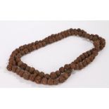 String of prayer beads formed from dried seeds/nuts, 170cm long