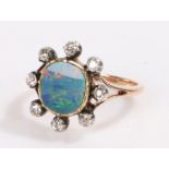 Opal and diamond ring, the central 1.5ct opal surrounded by eight diamonds estimated diamond
