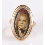 Gold coloured metal ring, the oval head set with a print depicting Sir Walter Scott FRSE FSA Scot (