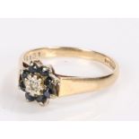 9 carat gold ring set with a central diamond chip surrounded by eight sapphires, ring size P1/2, 2.