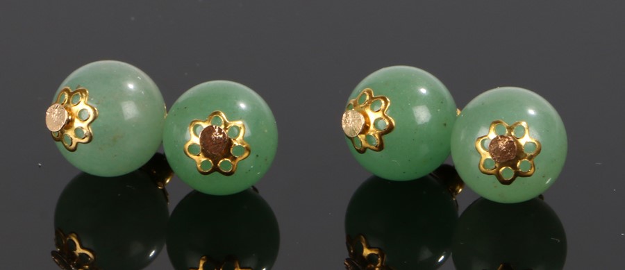 Pair of jade cufflinks, with foliate tipped ball links