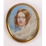 19th Century portrait miniature brooch, the central oval panel depicting a young lady amongst