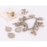 Silver charm bracelet set with twelve charms, four loose charms, 70g