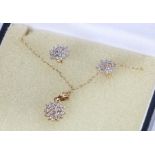 9 carat gold and diamond chip set jewellery set, comprising pair of earrings, necklace and