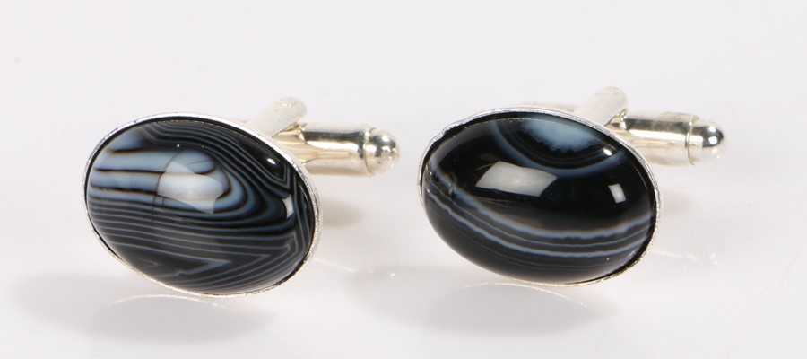 Pair of banded agate cufflinks, the heads of oval form