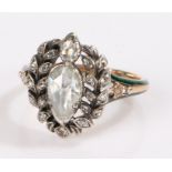 Diamond and green enamel ring, the central pear cut diamond estimated at 0.59ct, surrounded by a