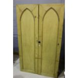 Pair of 20th Century pine wardrobes, with panelled doors opening to reveal a hanging pole above a