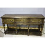 18th Century style oak dresser base, the rectangular top above three frieze drawers and board below,