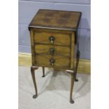 Mid 20th Century walnut veneered occasional table, with drop flaps, and three drawers raised on