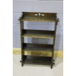 Art Deco style book case, the top with pierced decorations, with four shelves, 64cm wide